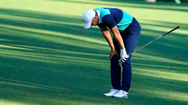 Jordan Spieth bends over in frustration on Friday at the 2022 Masters.